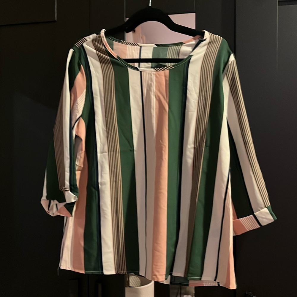 Woman’s stripped blouse. Never worn. No tags